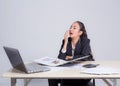 Tired sleepy woman yawning - working at office desk overwork and sleep Royalty Free Stock Photo