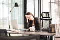Tired and sleepy young business woman at office desk Royalty Free Stock Photo