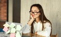 Tired sleepy young woman sitting at desk Royalty Free Stock Photo