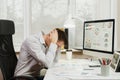 Serious and engrossed business man in shirt sitting at the desk, working at computer with modern monitor. Manager or worker. Royalty Free Stock Photo