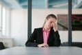 Tired stressed businesswoman feeling strong headache massaging temples exhausted from overwork, fatigued overwhelmed Royalty Free Stock Photo