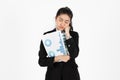 Tired stressed and confused young Asian business woman in suit troubled with financial problem over white isolated background Royalty Free Stock Photo