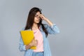 Tired indian woman student feel eye strain glasses isolated on grey background