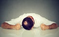 Tired, stressed man employee sleeping on a table