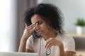 Tired stressed young african woman feel headache or eye strain Royalty Free Stock Photo