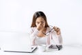 Tired and stressed young asian woman feel pain eyestrain and rubbing her eyes and take off her glasses Royalty Free Stock Photo