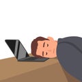 Tired and stressed young business man sleeping on his laptop in his office Royalty Free Stock Photo