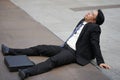 Tired or stressful businessman sitting on floor after being fired