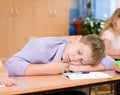 Tired student boy sleeping in classroom Royalty Free Stock Photo