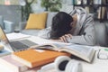 Tired student falling asleep over the desk