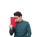 Tired student guy looking down with pessimistic emotion, holding a book, isolated on white background. Confused young man has
