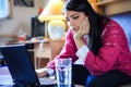 Tired student having a lot to read. Student is doing project on laptop. Student is studying. Study up Royalty Free Stock Photo