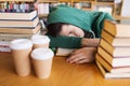 Tired student or man with books in library Royalty Free Stock Photo