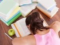 Tired student sleeping on book Royalty Free Stock Photo