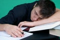 Tired student sleeping at the desk Royalty Free Stock Photo