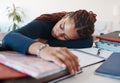Tired student sleeping at her desk while studying for university or college exams and test. Burnout young woman lying on Royalty Free Stock Photo
