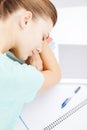 Tired student sleeping on stock of books