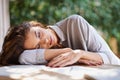 Tired, student and woman outdoor studying on table with notes in garden at university. Girl, relax and sleeping with Royalty Free Stock Photo