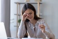 Tired woman rubbing eyes feeling fatigue from glasses computer work Royalty Free Stock Photo