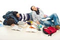 Tired students sleeping on floor