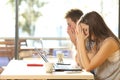 Tired students studying in a coffee shop Royalty Free Stock Photo