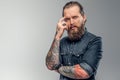 Tired man with beard and tattooes Royalty Free Stock Photo