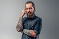 Tired man with beard and tattooes Royalty Free Stock Photo