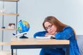 Tired teen girl falling asleep exhausted after long hours of learning exam test preparations. College female student Royalty Free Stock Photo