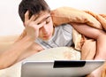 Tired Teenager with Tablet Computer Royalty Free Stock Photo