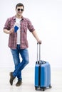 Tired tourist in anticipation of landing on aircraft waiting with baggage in airport terminal.