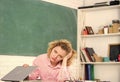 Tired tutor fall asleep at workplace. Woman tired in school classroom. Teacher exhausted after hard working day. School Royalty Free Stock Photo