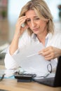 tired upset mature old businesswoman suffering from strong headache Royalty Free Stock Photo