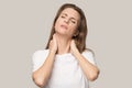 Tired upset woman massaging tensed neck muscles, stress relief