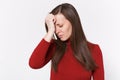 Tired upset young brunette woman girl in casual red clothes posing isolated on white background studio portrait. People Royalty Free Stock Photo