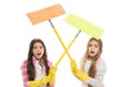 Tired of using a mop. Emotional little mop cleaners. Angry children crossing sticks with microfiber mop heads. Adorable Royalty Free Stock Photo