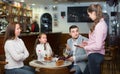 Tired waitress and displeased family Royalty Free Stock Photo