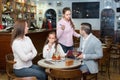 Tired waitress and displeased family Royalty Free Stock Photo