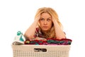 Tired woman with a basket of loundry annoyed with too much work Royalty Free Stock Photo
