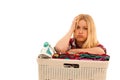 Tired woman with a basket of loundry annoyed with too much work Royalty Free Stock Photo