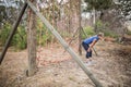 Tired woman bend down with hands on knees during obstacle course Royalty Free Stock Photo