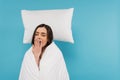 tired woman covered in white duvet Royalty Free Stock Photo