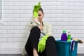 Tired woman doing house cleaning in bathroom. Fatigue, stress, cleanliness, home Royalty Free Stock Photo