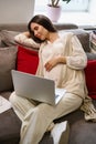 Tired woman is dozing on soft pillows