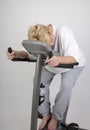 Tired woman on excercise bike