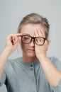 Tired woman in eyeglasses, covering eyes with hands Royalty Free Stock Photo