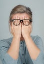 Tired woman in eyeglasses, covering face eyes hands Royalty Free Stock Photo