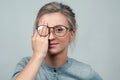 Tired woman in eyeglasses, covering eyes with hands Royalty Free Stock Photo