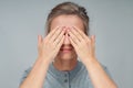 Tired woman in eyeglasses, covering face eyes hands Royalty Free Stock Photo