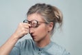 Tired woman has eyes pain. Optician and eyeglasses Royalty Free Stock Photo