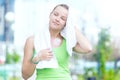 Tired woman after fitness time and exercising in city street par Royalty Free Stock Photo